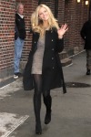 Brooklyn Decker walking in a short dress and tights