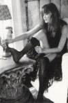 Carla Bruni playing with her stockings