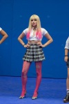 Chloe Grace Moretz wearing a skirt and pink ripped tights