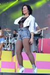Demi Lovato singing wearing black fishnet tights