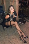 Elizabeth Gillies wering black fishnet tights