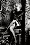 Eva Green crossing her legs in black sheer stockings