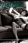 Eva Mendes on sofa in nylon stockings