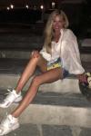 Federica Panicucci showing off her bare legs