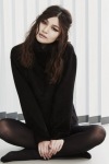 Gemma Chan in a black mise