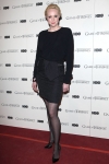 Gwendoline Christie wearing short dress and black tights