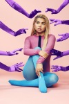 Hayley Kiyoko posing in blue tights