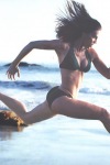 Hilary Swank running on the beach