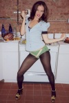 Juliette Lewis in the kitchen wearing sheer stockings