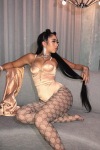 Kali Uchis wearing fashion tights