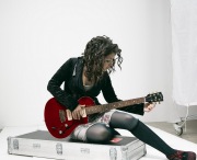 Katie Melua playing guitar