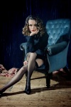 Keira Knightley with crossed legs in hold ups