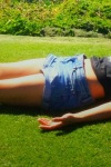 Kristin Kreuk on the grass