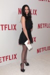 Laura Prepon wearing black sheer tights and sandals
