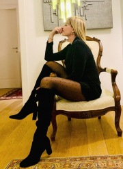 Manila Nazzaro wearing black tights and boots