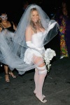 Mariah in white wedding dress with stockings