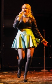 Meghan Elizabeth Trainor on stage in sheer tights