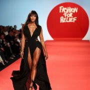 Naomi Campbell showing off her perfect legs in a black dress