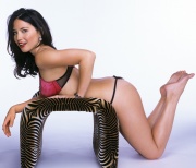 Olivia Munn showing off her feet wearing red lingerie
