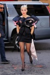 Rita Ora wearing sheer tights and high heels